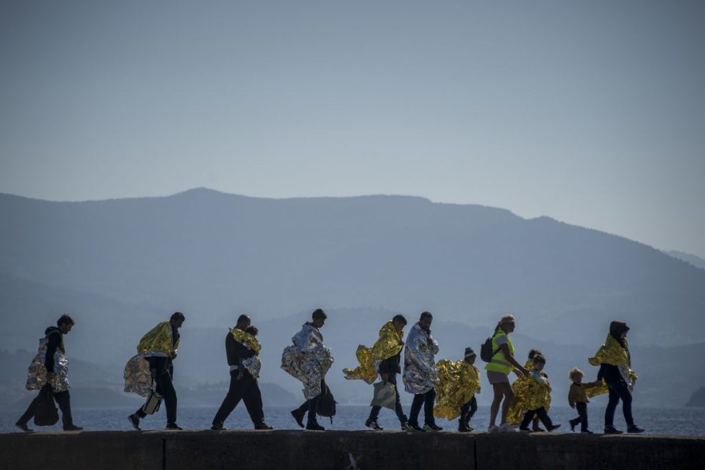 Refugees and Migrants arrive in the Molyvos port, after greek coastguard vessel hits migrant boat on the Greek Island of Lesbos, on October 15, 2015. More than 400,000 refugees, mostly Syrians and Afghans, arrived in Greece since early January while dozens were drowned trying to make the crossing. In total 710,000 have entered the EU through Greece and Italy during the same period, according to the European Agency Frontex border surveillance. The migration issue has caused deep divisions within the European Union, which is trying to set the distribution of migrants among its member countries or limit the flow. (Photo by Antonio Masiello/NurPhoto) (Photo by NurPhoto/NurPhoto via Getty Images)