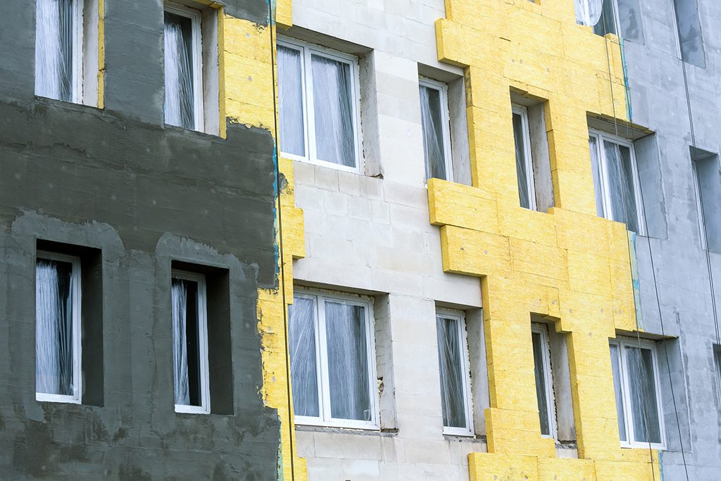 Concrete wall of building with insulation for thermal protection