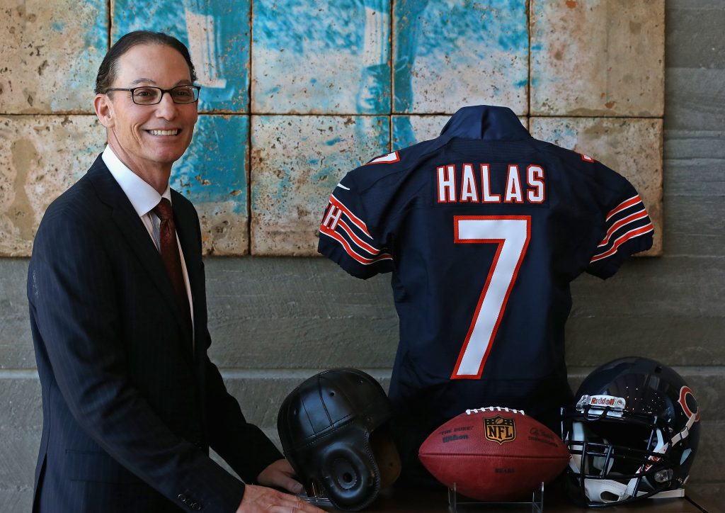 LAKE FOREST, IL - JANUARY 17: Marc Trestman, the new head coach of the Chicago Bears, poses with a George Halas jersey following an introductory press conference at Halas Hall on January 17, 2013 in Lake Forest, Illinois.   Jonathan Daniel/Getty Images/AFP