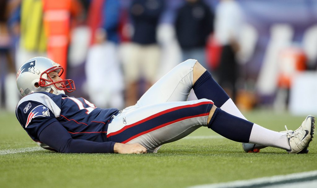 FOXBORO, MA - SEPTEMBER 18: Zoltan Mesko #14 of the New England Patriots reacts after he is hit during a punt in the second half against the San Diego Chargers on September 18, 2011 at Gillette Stadium in Foxboro, Massachusetts.   Elsa/Getty Images/AFP