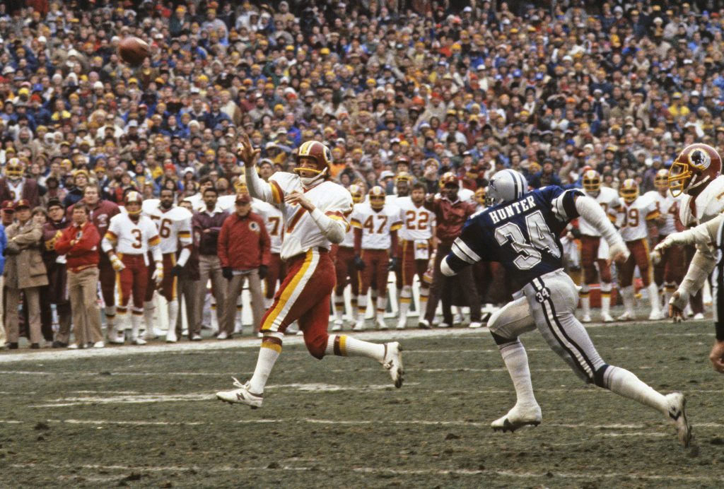 Washington Redskins quarterback Joe Theismann (7) throws a pass during the NFL football game NFC Championship between the Dallas Cowboys and the Washington Redskins in Washington, DC  on January 22, 1983. The Redskins won the game 31-17. (AP Photo/Paul Spinelli)