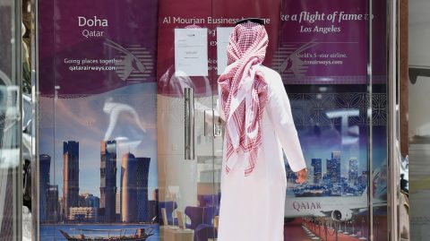 A picture taken on June 5, 2017 shows a man standing outside the Qatar Airways branch in the Saudi capital Riyadh, after it had suspended all flights to Saudi Arabia following a severing of relations between major gulf states and gas-rich Qatar.
Arab nations including Saudi Arabia and Egypt cut ties with Qatar accusing it of supporting extremism, in the biggest diplomatic crisis to hit the region in years. / AFP PHOTO / FAYEZ NURELDINE