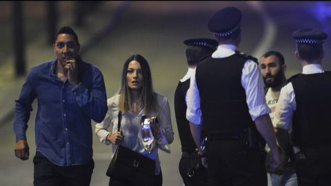 Members of the public leave the scene of a terror attack on London Bridge in central London on June 3, 2017.
Armed police opened fire during what they described as a "terrorist" attack in central London Saturday after reports of stabbings and a van ploughing into pedestrians just days ahead of a general election. / AFP PHOTO / DANIEL SORABJI