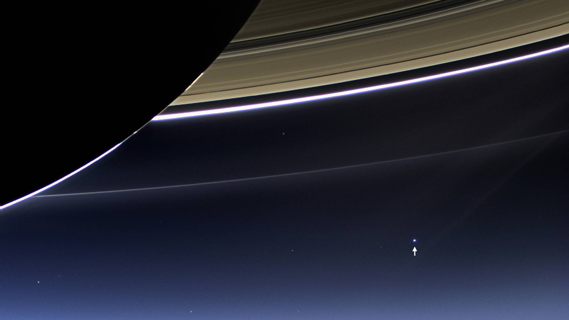 In this rare image taken on July 19, 2013, the wide-angle camera on NASA's Cassini spacecraft has captured Saturn's rings and our planet Earth and its moon in the same frame. It is only one footprint in a mosaic of 33 footprints covering the entire Saturn ring system (including Saturn itself). At each footprint, images were taken in different spectral filters for a total of 323 images: some were taken for scientific purposes and some to produce a natural color mosaic. This is the only wide-angle footprint that has the Earth-moon system in it. (Photo by NASA/Handout/Corbis via Getty Images)