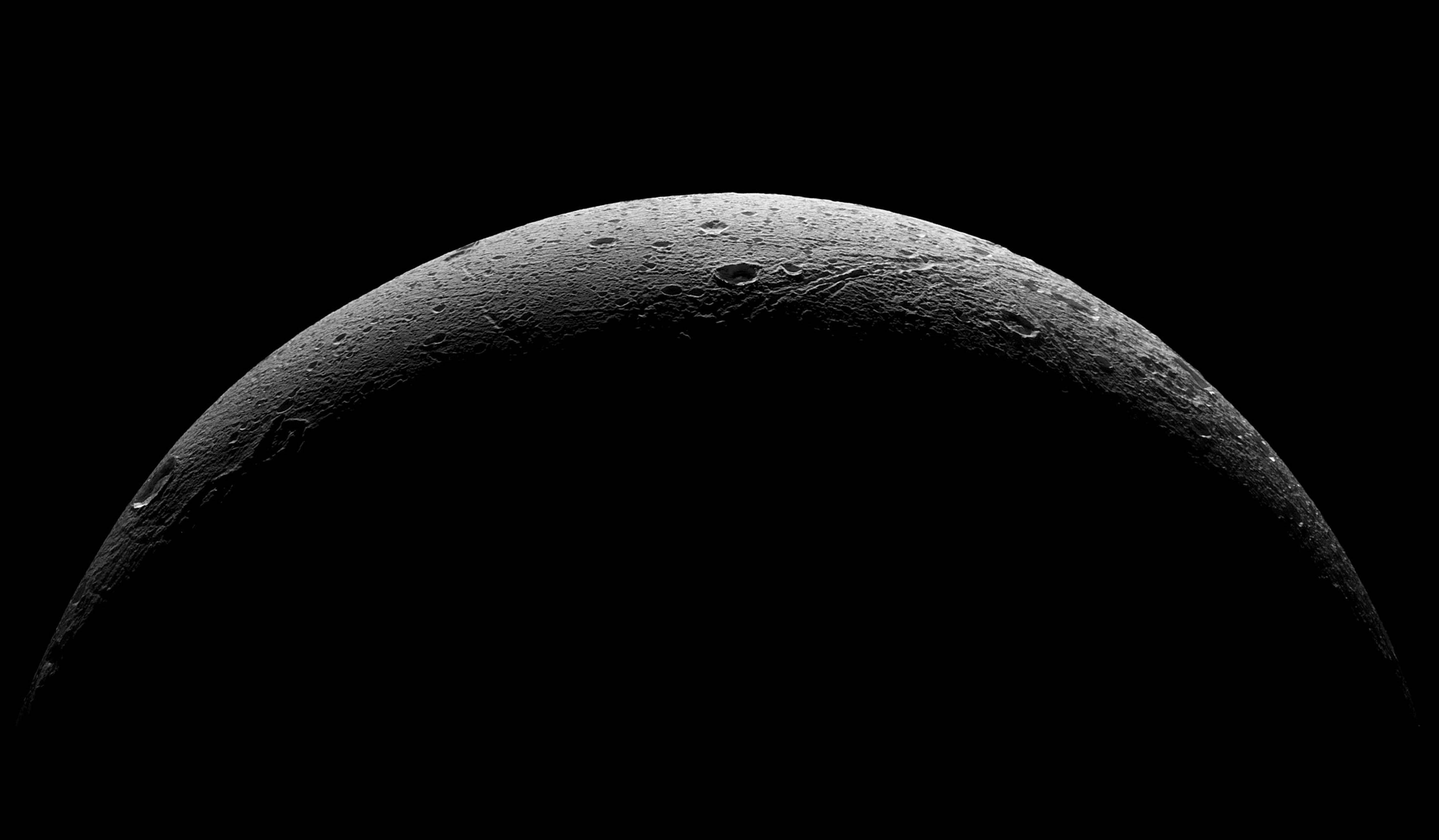 This NASA handout released August 20, 2015 shows the rough and icy crescent of Saturn's moon Dione in this view taken by NASA's Cassini spacecraft on the outbound leg of its last close flyby of the icy moon. North on Dione is up. The image was obtained in visible light with the Cassini spacecraft wide-angle camera on August 17, 2015. The view was acquired at distances ranging from approximately 37,000 miles (59,000 kilometers) to 47,000 miles (75,000 kilometers) from Dione  == RESTRICTED TO EDITORIAL USE / MANDATORY CREDIT: "AFP PHOTO / HANDOUT / NASA/JPL-Caltech/Space Science Institute "/ NO MARKETING / NO ADVERTISING CAMPAIGNS / DISTRIBUTED AS A SERVICE TO CLIENTS == / AFP PHOTO / NASA/JPL-Caltech/SSI / --