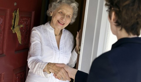Senior woman friendly handshake