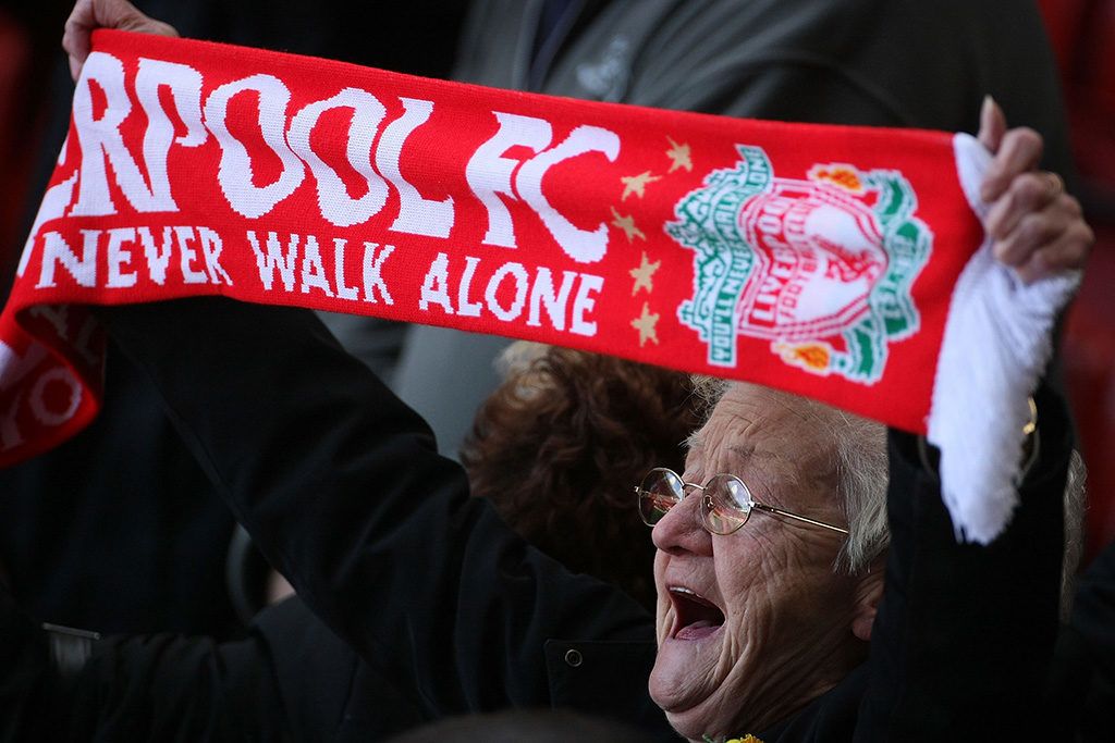 LIVERPOOL, UNITED KINGDOM - APRIL 15:  A Liverpool fan sings 'You'll Never Walk Alone' during a service at Anfield football stadium in Liverpool to mark the 19th anniversary of the Hillsborough disaster on 15 April, 2008, Liverpool, England.  A total of 96 Liverpool supporters lost their lives during a crush at an FA Cup semi final against Nottingham Forest at the Hillsborough football ground in Sheffield, South Yorkshire in 1989.  (Photo by Christopher Furlong/Getty Images)