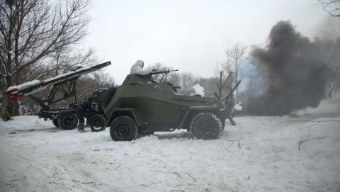 3282734 01/28/2018 A BA-64 Soviet armored scout car, foreground, and a BM-13 Katyusha multiple rocket launcher during the historical reenactment staged to mark 75th anniversary of Voronezh's liberation from Nazi-Fascist invaders in the Voronezh Region. Uliana Solovyova/Sputnik