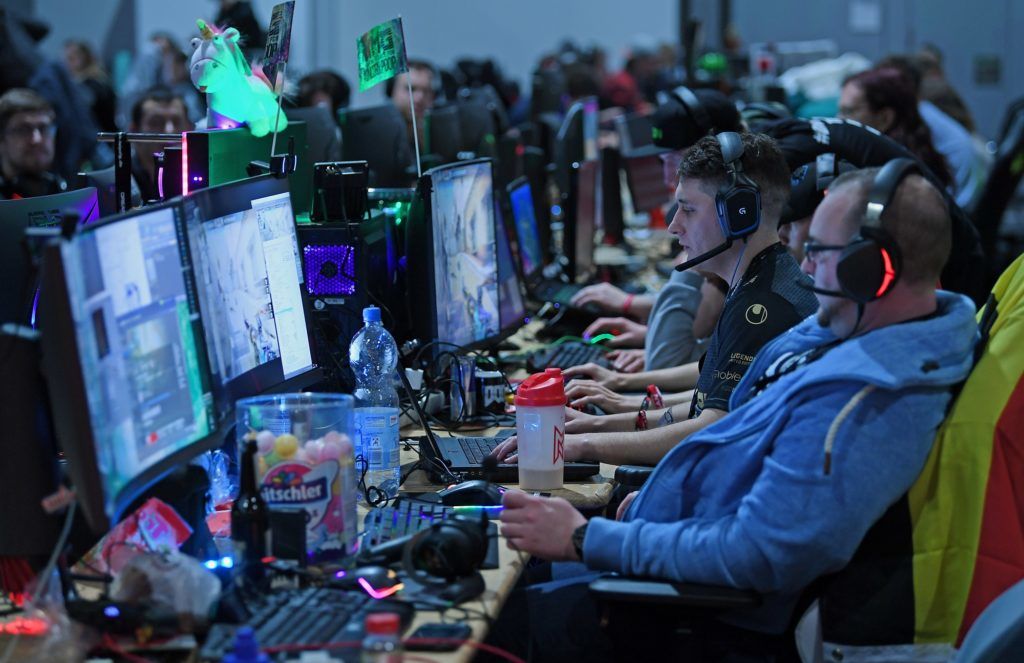 Participants of the eSport festival "Dreamhack" playing in front of their computer screens at the fair in Leipzig, Germany, 26 January 2018. Thousands of gaming fans are expected until Sunday, 28 January 2018. This year 1732 places have been booked - a record number in the young history of Dreamhack. The players are able to play 56 hours at a time. Photo: Hendrik Schmidt/dpa-Zentralbild/dpa