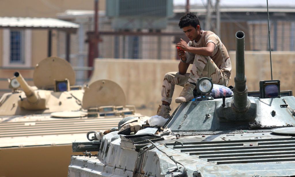 A member of the Iraqi government forces checks his mobile phone while sitting on an infantry fighting vehicle in Fallujah, 50 kilometres (30 miles) from the capital Baghdad, after forces retook the embattled city from the Islamic State group on June 26, 2016.




Iraqi Prime Minister Haider al-Abadi urged all Iraqis to celebrate the recapture of Fallujah by the security forces and vowed the national flag would be raised in Mosul soon. While the battle has been won, Iraq still faces a major humanitarian crisis in its aftermath, with tens of thousands of people who fled the fighting desperately in need of assistance in the searing summer heat.



 / AFP PHOTO / HAIDAR MOHAMMED ALI