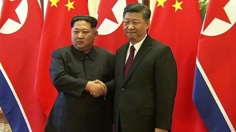 This video grab taken from footage released by China Central Television (CCTV) on March 28, 2018 shows Chinese President Xi Jinping (R) and North Korean leader Kim Jong Un shaking hands during their meeting in Beijing on March 27, 2018.
Kim told Xi that it was his "solemn duty" to make Beijing his first overseas destination as he made his maiden foreign trip as leader, Pyongyang's official news agency reported on March 28. / AFP PHOTO / CCTV / CCTV /  - China OUT / RESTRICTED TO EDITORIAL USE - MANDATORY CREDIT "AFP PHOTO / CCTV" - NO MARKETING NO ADVERTISING CAMPAIGNS - DISTRIBUTED AS A SERVICE TO CLIENTS