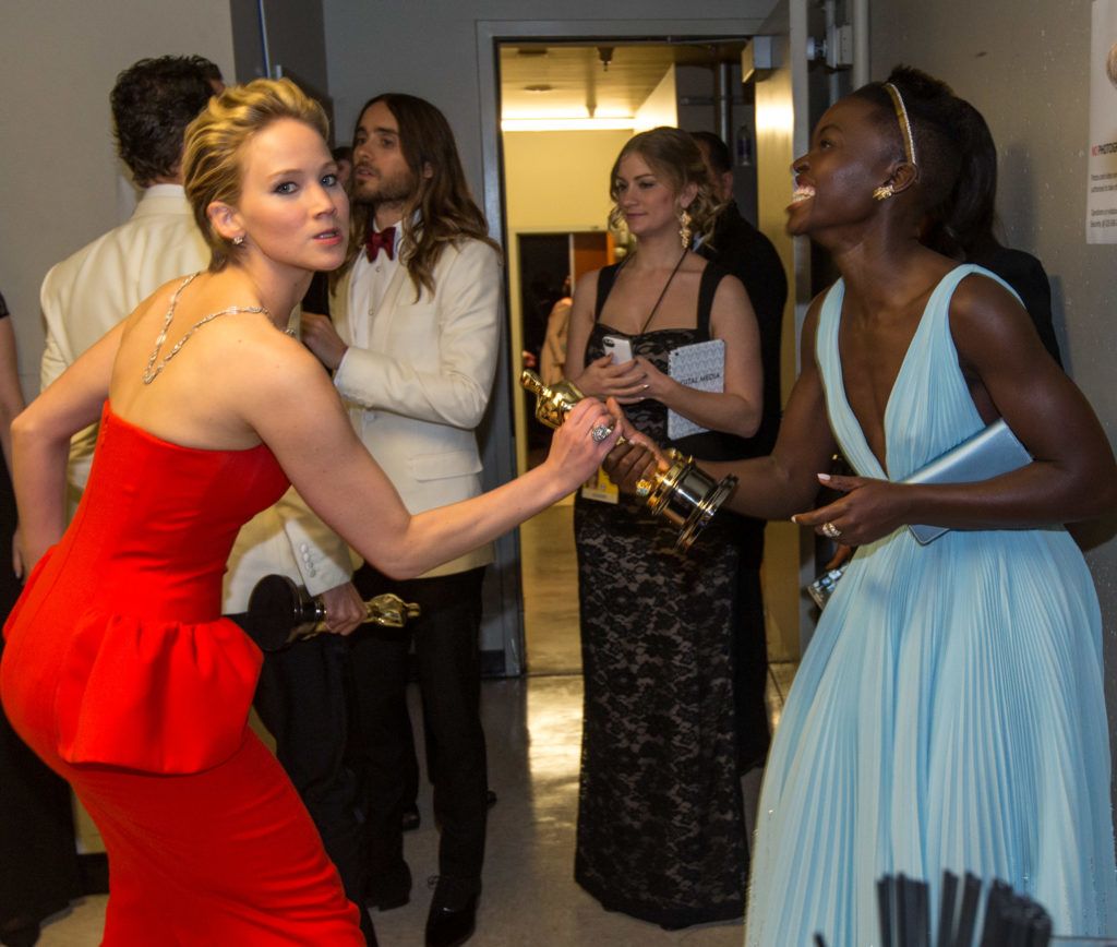 HOLLYWOOD, CA - MARCH 02:  Actresses Jennifer Lawrence (L) and Lupita Nyong'o backstage during the Oscars held at Dolby Theatre on March 2, 2014 in Hollywood, California.  (Photo by Christopher Polk/Getty Images)