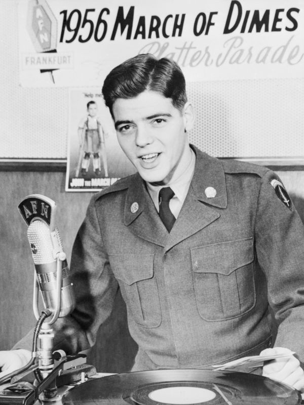 (Original Caption) Supporting the U.S. Army northern area command's March of Dimes is Private Nick Clooney, brother of singer Rosemary Clooney. He is a disc jockey for the Armed Forces network "Platter Parade," broadcast yearly in support of the campaign to raise funds for the fight against infantile paralysis.