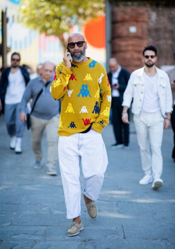 FLORENCE, ITALY - JUNE 14: A guest wearing mustard Kappa knit is seen during the 94th Pitti Immagine Uomo on June 14, 2018 in Florence, Italy. (Photo by Christian Vierig/Getty Images)