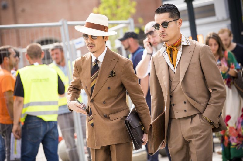 FLORENCE, ITALY - JUNE 14:   Gentlemen, wearing tan suits, are seen during the 94th Pitti Immagine Uomo at Fortezza Da Basso on June 14, 2018 in Florence, Italy. (Photo by Claudio Lavenia/Getty Images)