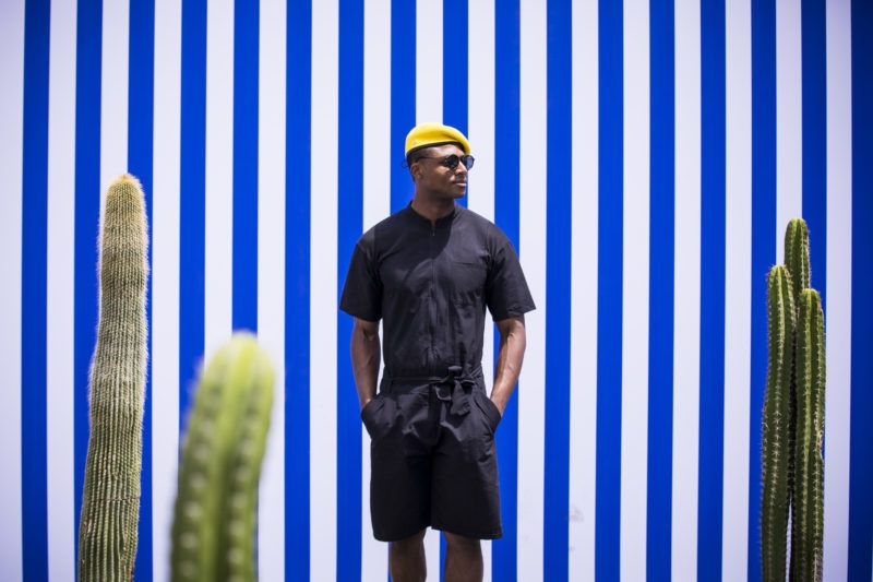 FLORENCE, ITALY - JUNE 14:   Alvin Alto, wearing a yellow hat, black shirt and black shorts, is seen during the 94th Pitti Immagine Uomo at Fortezza Da Basso on June 14, 2018 in Florence, Italy. (Photo by Claudio Lavenia/Getty Images)