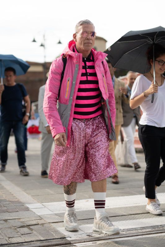 FLORENCE, ITALY - JUNE 13: Nick Wooster is seen during the 94th Pitti Immagine Uomo wearing a pink ski jacket, pink striped shirt, and pink sequin shorts on June 13, 2018 in Florence, Italy. (Photo by Matthew Sperzel/Getty Images)