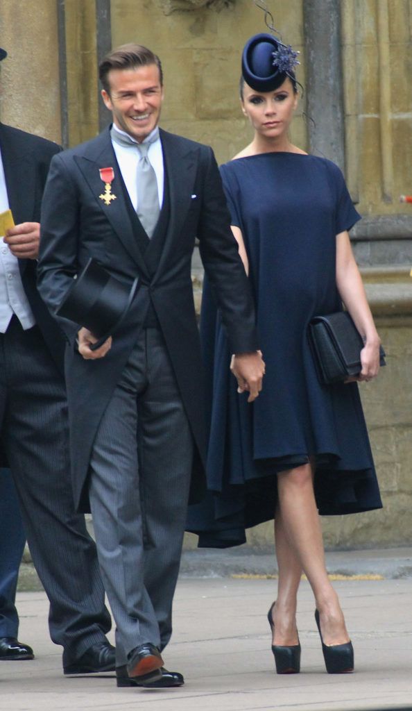 David Beckham and Victoria Beckham arrive to attend the Royal Wedding of Prince William to Catherine Middleton at Westminster Abbey on April 29, 2011 in London, England. The marriage of the second in line to the British throne is to be led by the Archbishop of Canterbury and will be attended by 1900 guests, including foreign Royal family members and heads of state. Thousands of well-wishers from around the world have also flocked to London to witness the spectacle and pageantry of the Royal Wedding.