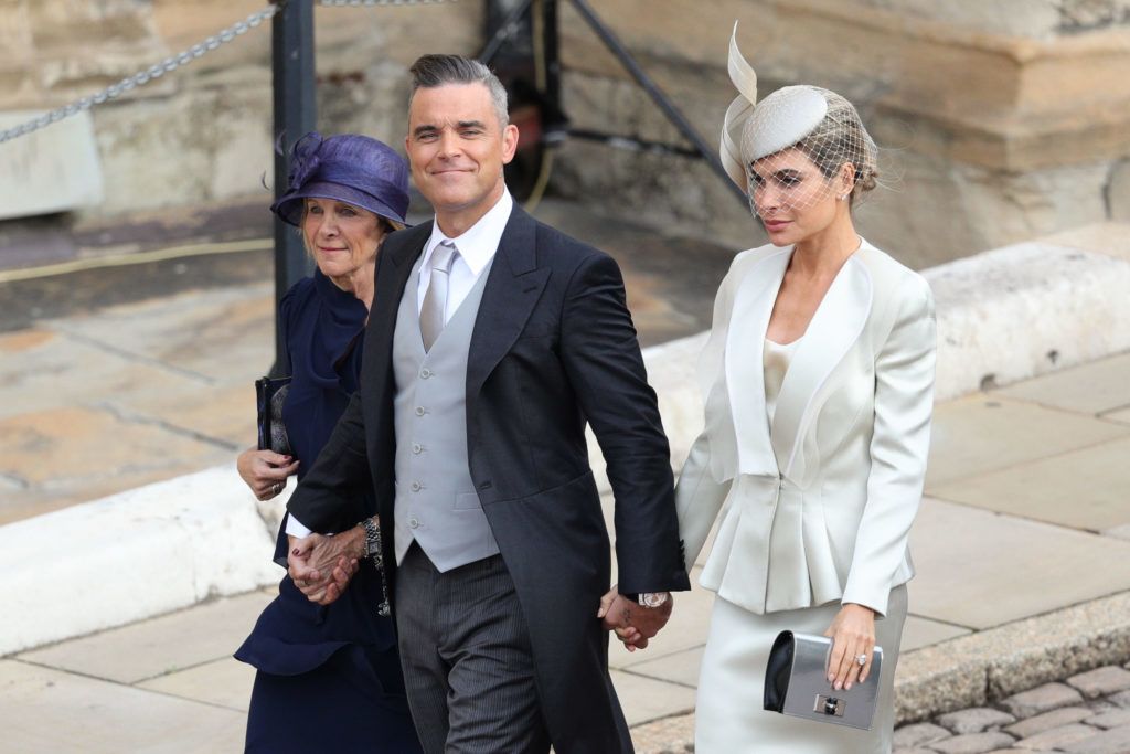 WINDSOR, ENGLAND - OCTOBER 12:  Gwen Field, Robbie Williams and Ayda Field  arrive ahead of the wedding of Princess Eugenie of York and Mr. Jack Brooksbank at St. George's Chapel on October 12, 2018 in Windsor, England. (Photo by Aaron Chown - WPA Pool/Getty Images)
