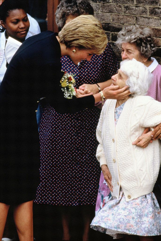 LONDON, UNITED KINGDOM - SEPTEMBER 18:  Diana, Princess of Wales, greets Nellie Corbett, 91, during her visit to the Lord Gage Centre for old people, a guinness trust home In Newham, East London on September 18, 1990 in London, England.  (Photo by Georges De Keerle/Getty Images)