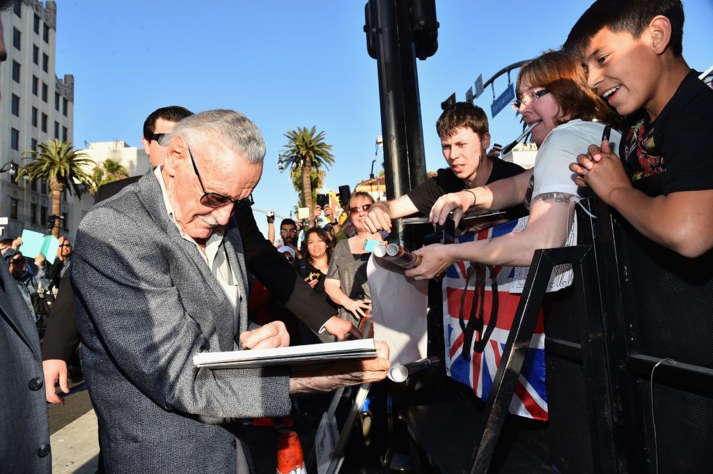 HOLLYWOOD, CA - APRIL 13: executive producer Stan Lee (L) signs autographs for fans at the world premiere of Marvel's "Avengers: Age Of Ultron" at the Dolby Theatre on April 13, 2015 in Hollywood, California.   Alberto E. Rodriguez/Getty Images for Disney/AFP