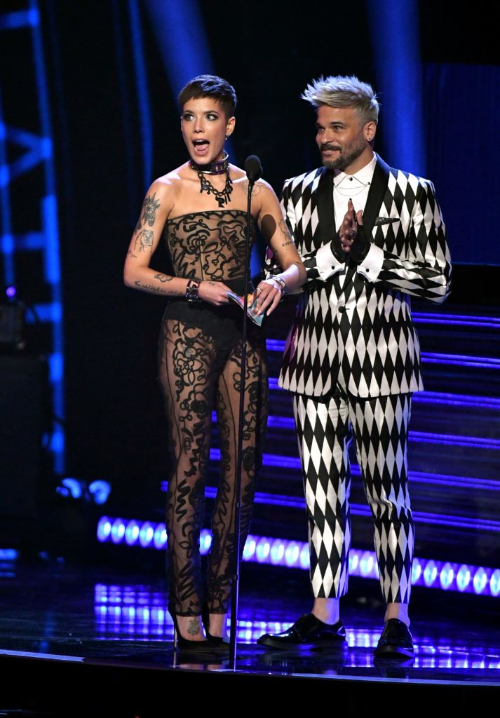LAS VEGAS, NV - NOVEMBER 15:  Halsey (L) and Pedro Capo speak onstage during the 19th annual Latin GRAMMY Awards at MGM Grand Garden Arena on November 15, 2018 in Las Vegas, Nevada.  (Photo by Ethan Miller/Getty Images for LARAS)