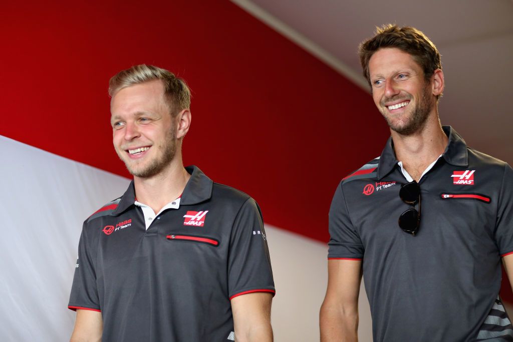 BUDAPEST, HUNGARY - JULY 27:  Romain Grosjean of France and Haas F1 and Kevin Magnussen of Denmark and Haas F1 walk in the Paddock after practice for the Formula One Grand Prix of Hungary at Hungaroring on July 27, 2018 in Budapest, Hungary.  (Photo by Charles Coates/Getty Images)