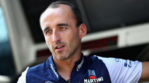 MONZA, ITALY - AUGUST 30:  Robert Kubica of Poland and Williams talks on the pit wall during previews ahead of the Formula One Grand Prix of Italy at Autodromo di Monza on August 30, 2018 in Monza, Italy.  (Photo by Mark Thompson/Getty Images)
