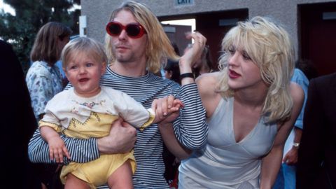 Kurt Cobain of Nirvana with wife Courtney Love and daughter Frances Bean Cobain at the Universal Ampitheater in Universal City, California (Photo by Kevin Mazur/WireImage)