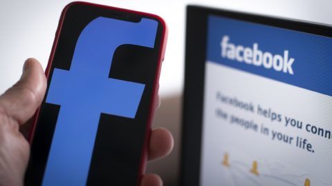 The Facebook logo is seen on a mobile device with the Facebook login screen in the background in this photo illustration on March 13, 2019 in Warsaw, Poland. (Photo by Jaap Arriens/NurPhoto)